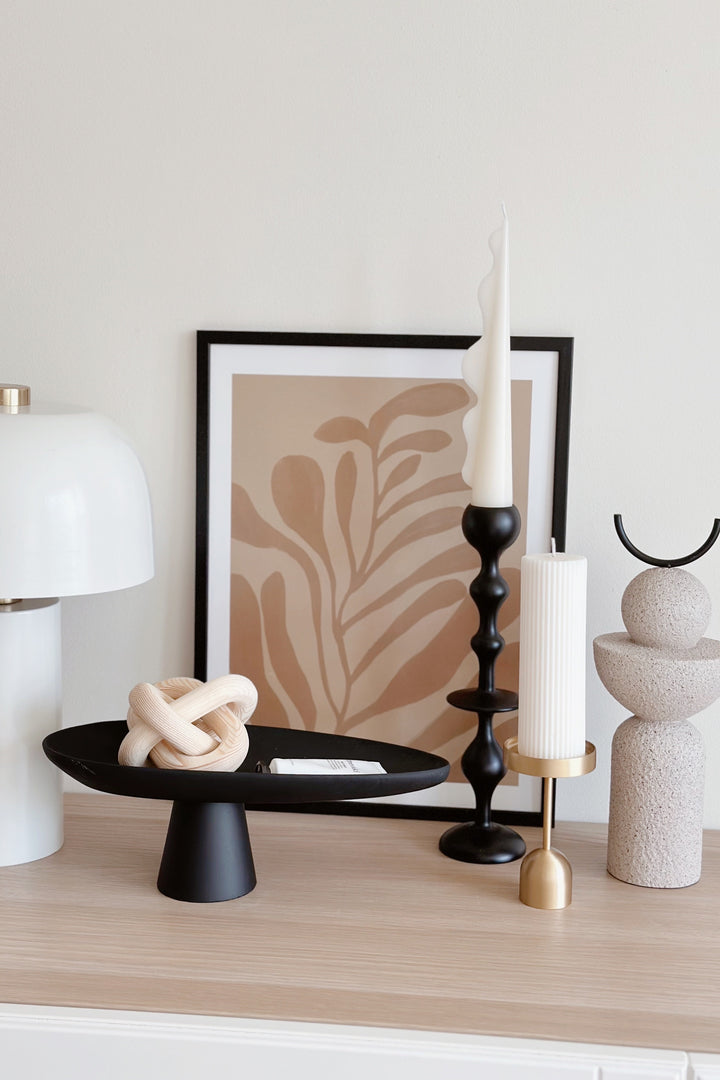 Sleek Black Leaf on Pedestal