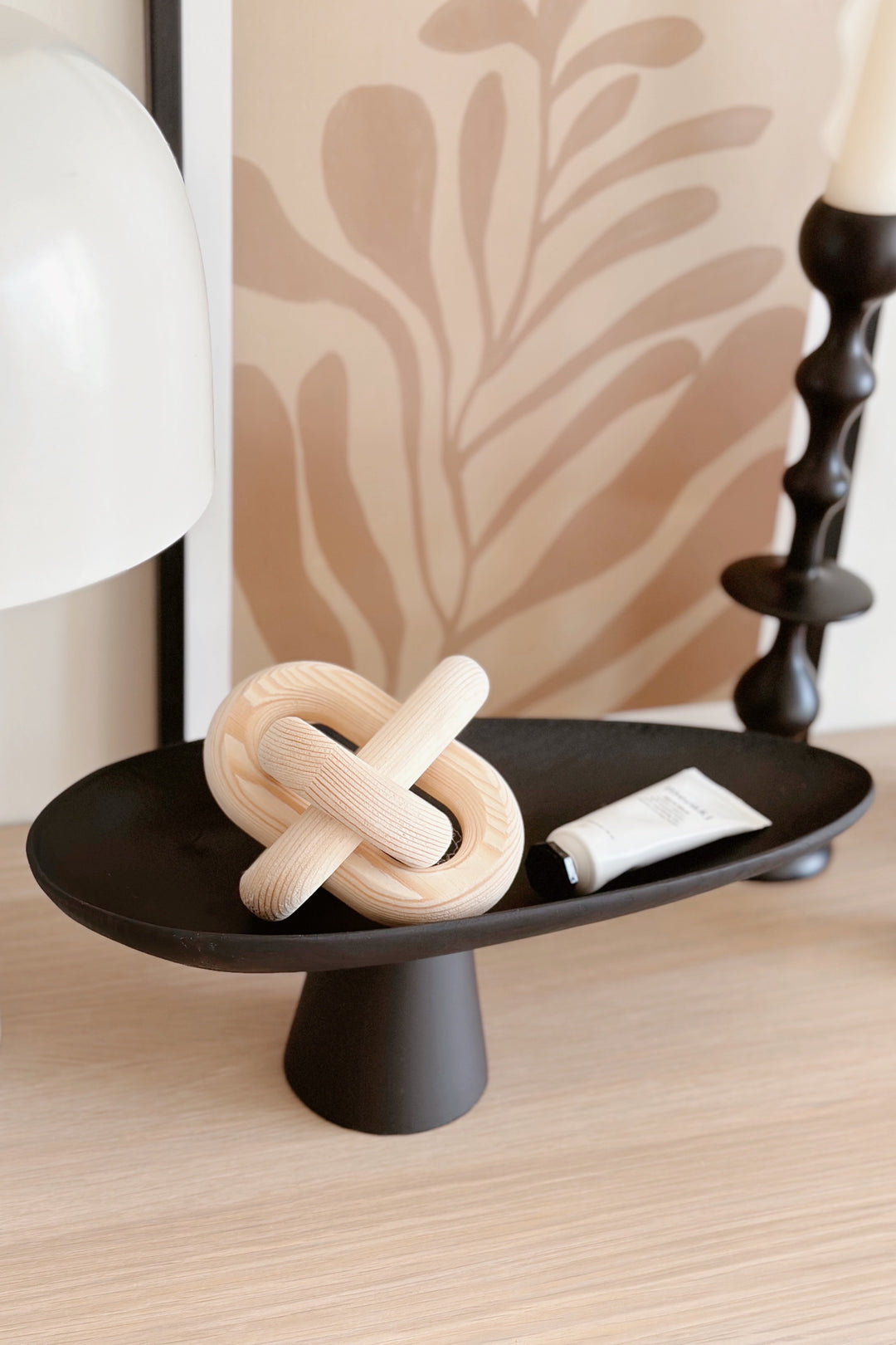 Sleek Black Leaf on Pedestal