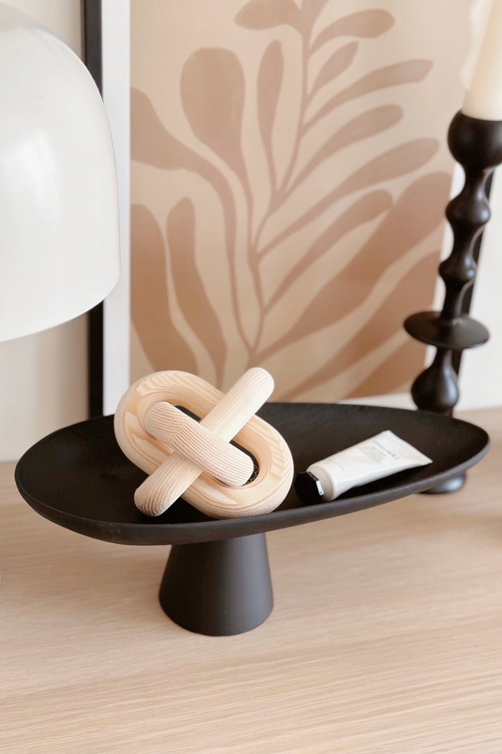 Sleek Black Leaf on Pedestal