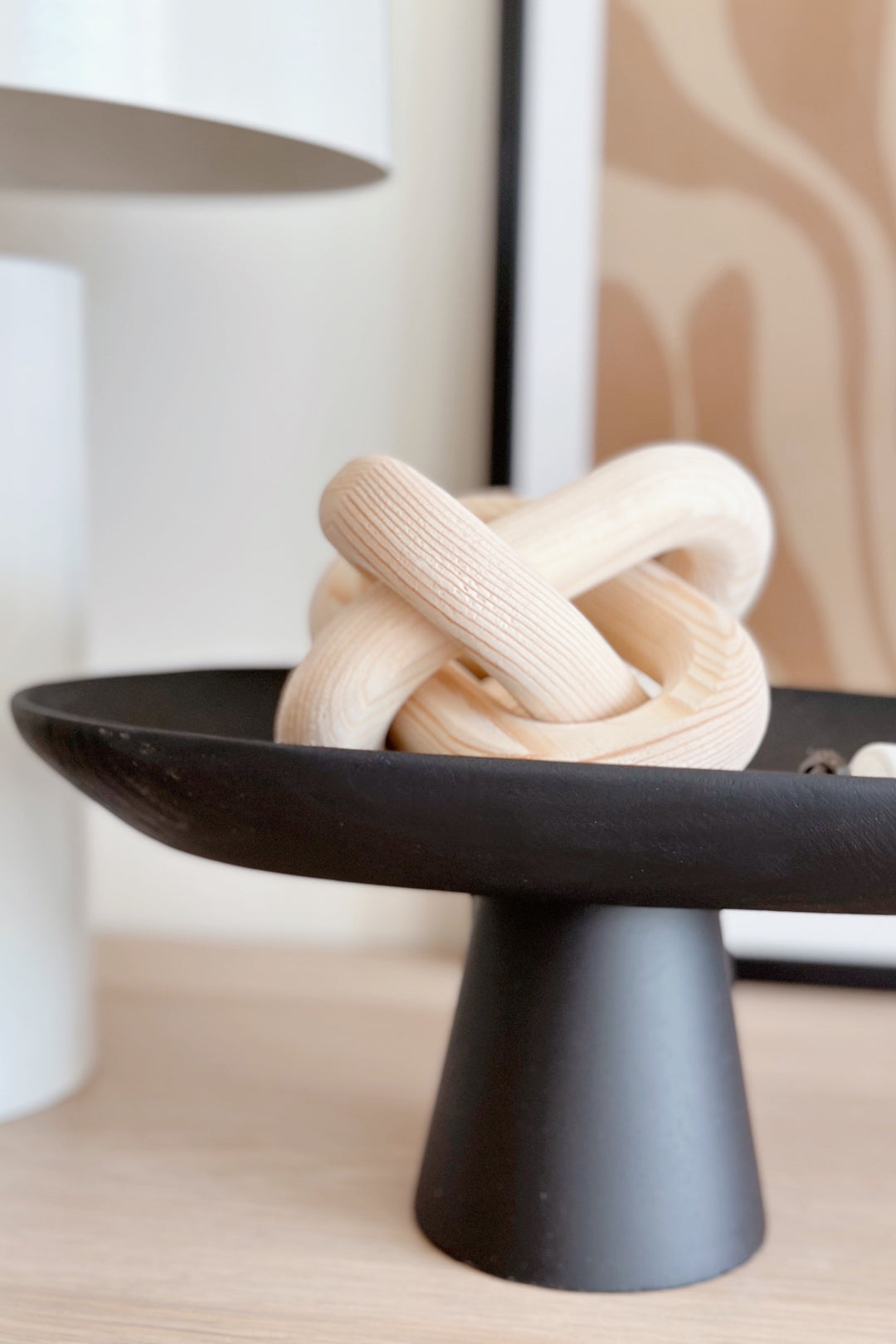 Sleek Black Leaf on Pedestal