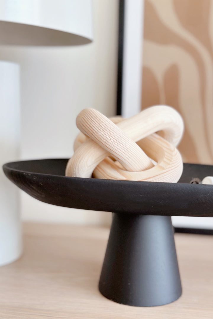 Sleek Black Leaf on Pedestal