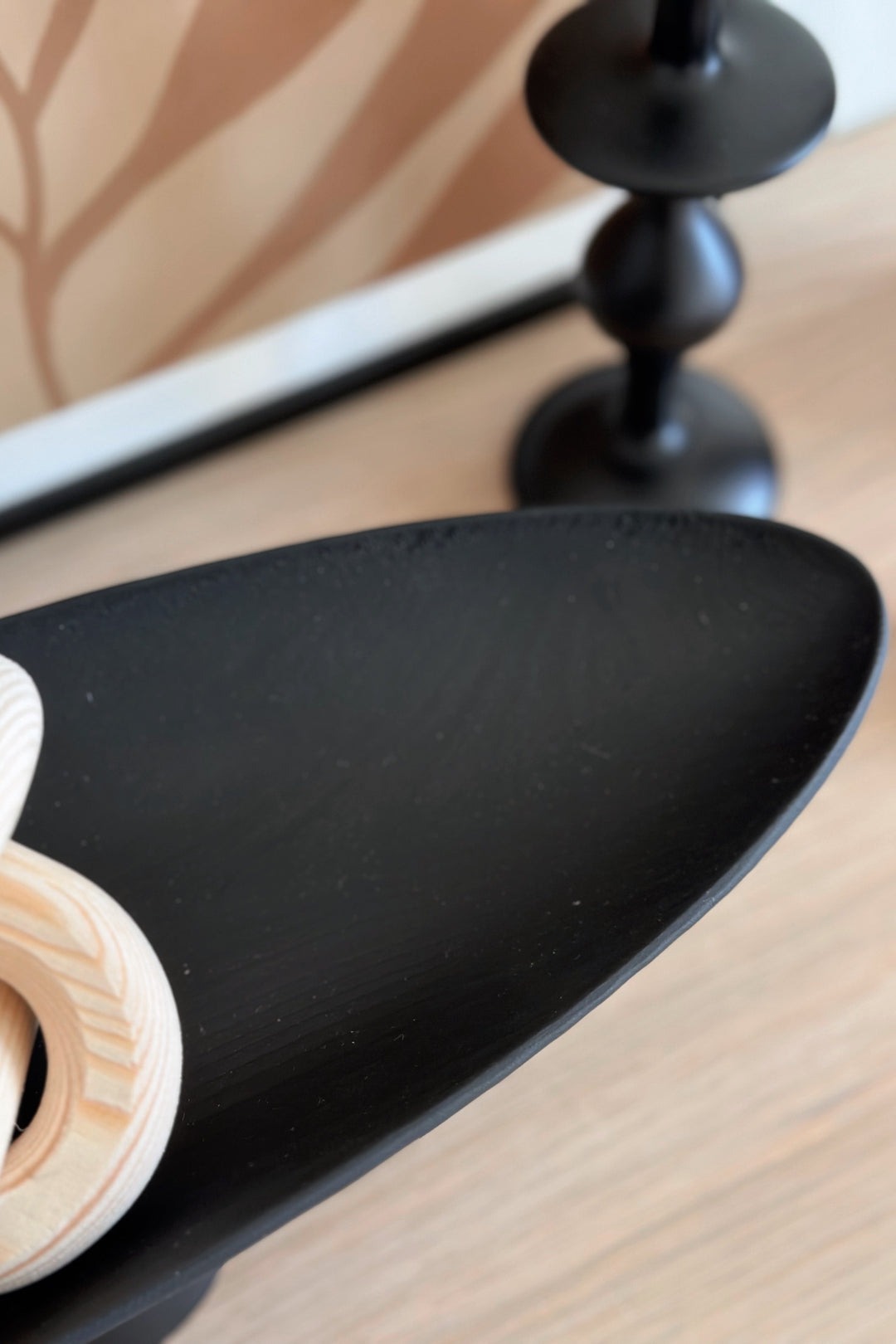 Sleek Black Leaf on Pedestal