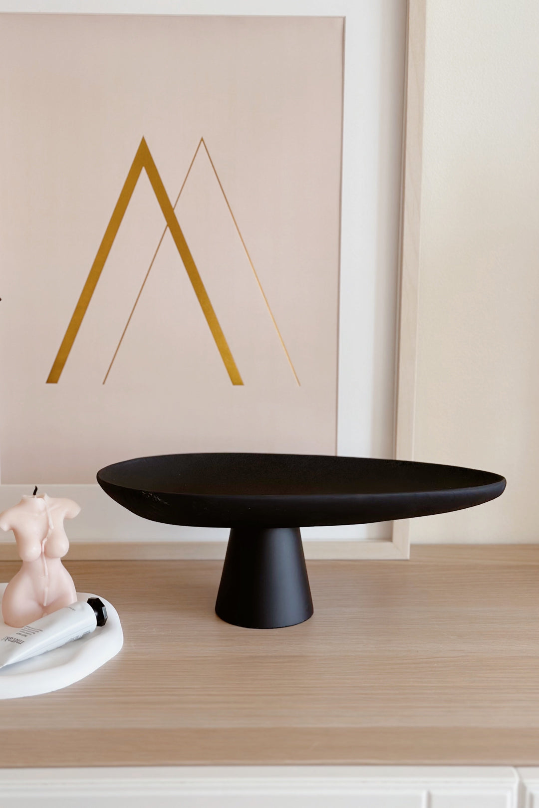 Sleek Black Leaf on Pedestal