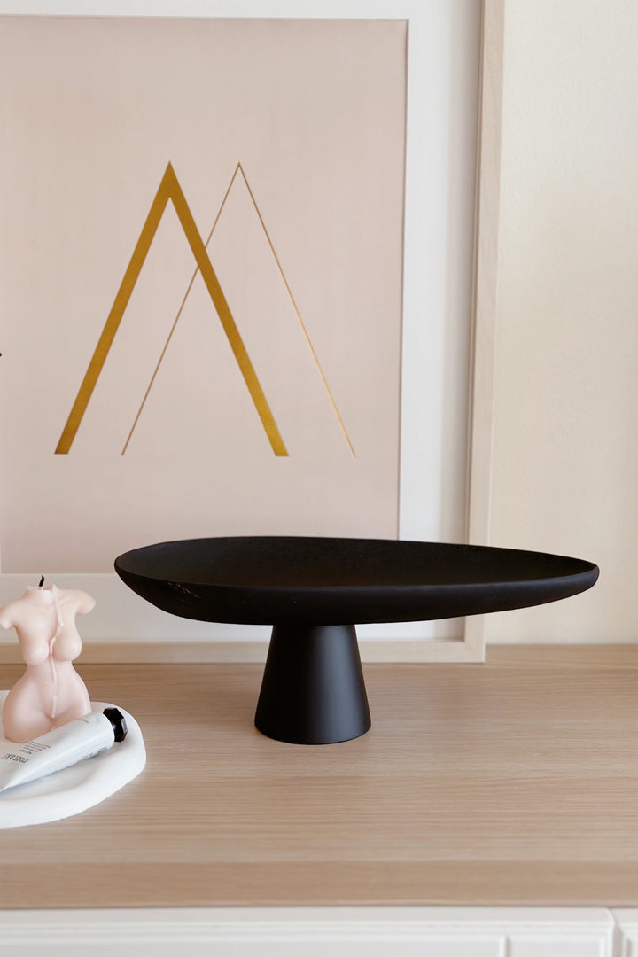 Sleek Black Leaf on Pedestal