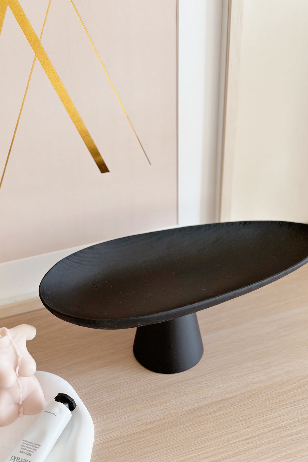 Sleek Black Leaf on Pedestal